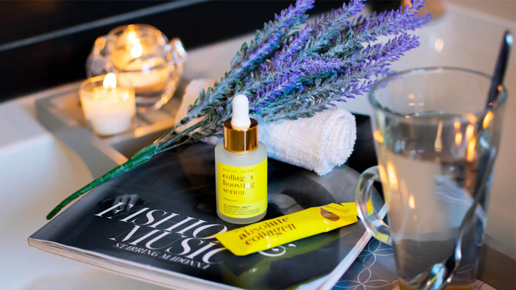 Photo of a bath with lavender, candles, a magazine, Absolute Collagen and Maxerum